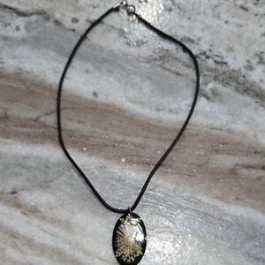 Handmade resin pendant necklace with a preserved sunflower inside. 16"